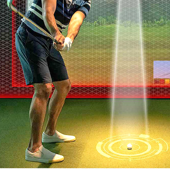 Golfer using the EvenPlay competition platform in a simulator